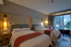 Postel nebo postele na pokoji v ubytování JW Marriott Hotel New Delhi Aerocity