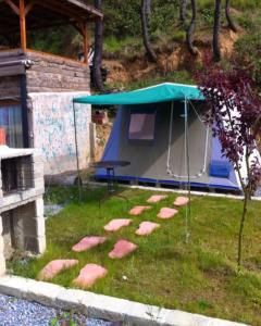 a tent with stepping stones in the grass at SB KAMP ŞİLE in Şile
