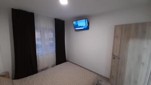 TV a/nebo společenská místnost v ubytování Delia Apartament + 3 fotografie
