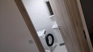 Koupelna v ubytování Delia Apartament