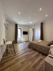 TV a/nebo společenská místnost v ubytování Gata Galleria Taranto