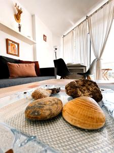 a group of breads on a bed in a room at TwinTorres LasAmericas in Playa de las Americas