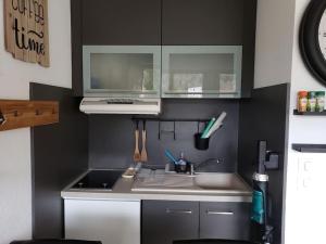 Dapur atau dapur kecil di appartement résidence val soleil.