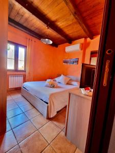 a bedroom with a bed and a television in it at Acquamarina in Gaeta