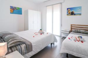 Postel nebo postele na pokoji v ubytování Appartamenti Gherbin Jesolo