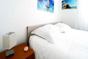 Postel nebo postele na pokoji v ubytování Appartamenti Gherbin Jesolo