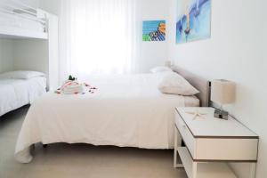 Postel nebo postele na pokoji v ubytování Appartamenti Gherbin Jesolo