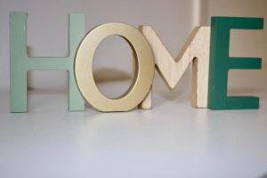 a wooden sign for the word love on a table at Casa Desi in Baura +17 photos
