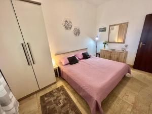 Posteľ alebo postele v izbe v ubytovaní Apartmani Zeleni Raj