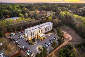 an overhead view of a building with a parking lot at Wingate by Wyndham State Arena Raleigh/Cary Hotel in Raleigh