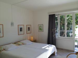 Postel nebo postele na pokoji v ubytování Apartments Posta al Lago