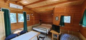 a room with a bed in a log cabin at Casa di Pier e Nanni by Salento com in Gallipoli