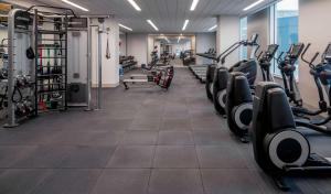 a gym with treadmills and elliptical machines at Hyatt Regency Portland at the Oregon Convention Center in Portland