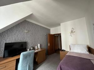 Postel nebo postele na pokoji v ubytování Hotel Radnice