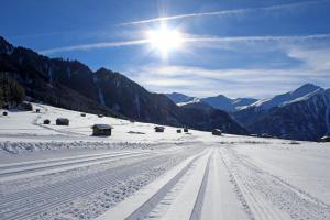 a snow covered mountain with the sun in the sky at Aenna Apart Prutz in Prutz +159 photos