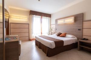 Postel nebo postele na pokoji v ubytování NilHotel Florence