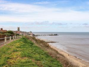 a view of the ocean and a beach at 107 Kings Chalet Park in Cromer