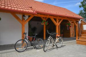 two bikes parked in front of a building at Nana’s Vendégház in Mád