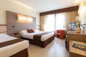 Postel nebo postele na pokoji v ubytování NilHotel Florence