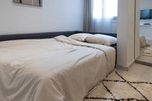 Posteľ alebo postele v izbe v ubytovaní Le Victorieux - Appart 2 pièces -Proche Paris