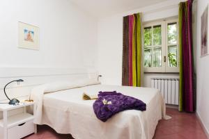 Postel nebo postele na pokoji v ubytování Appartamenti Le Pleiadi - Succhivo d'Ischia