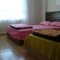 A bed or beds in a room at Nemrut Dağı Işik Pansi̇on