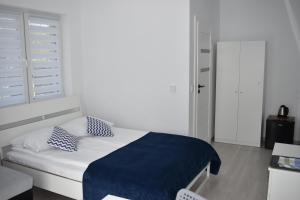Postel nebo postele na pokoji v ubytování Kompleks Wypoczynkowy DUET - pokoje gościnne