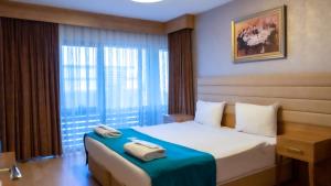 Bursa Suites Apart Otel客房内的一张或多张床位