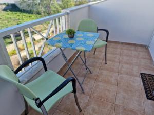a table and two chairs on a balcony at Apartment in Tigaki beach Kos in Tigaki