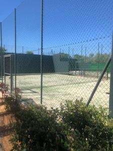 a chain link fence on a baseball field at PLAYA VERDE LUXURY in Ayamonte