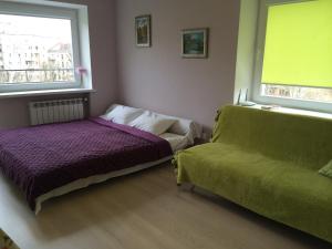 A bed or beds in a room at Centre Apartment