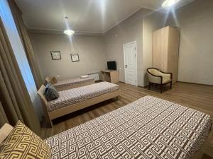 Uma cama ou camas num quarto em Гостиница Amulet