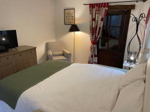 Posteľ alebo postele v izbe v ubytovaní Le Douet Fleury - Chambre d'Hôtes et Gîtes