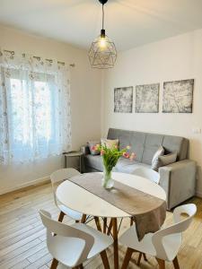 a living room with a table and a couch at Casa Divina in Figline Valdarno