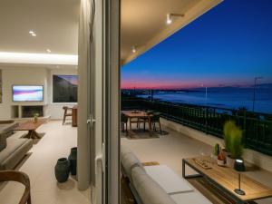 a living room with a view of the ocean at Zuzu Riviera Living in Hersonissos