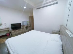 TV in/ali zabaviščno središče v nastanitvi A22 Wei Lu Hotel