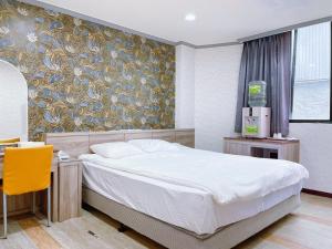 Postelja oz. postelje v sobi nastanitve A22 Wei Lu Hotel