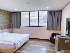 Postelja oz. postelje v sobi nastanitve A22 Wei Lu Hotel