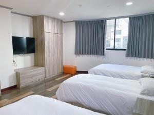 Postelja oz. postelje v sobi nastanitve A22 Wei Lu Hotel