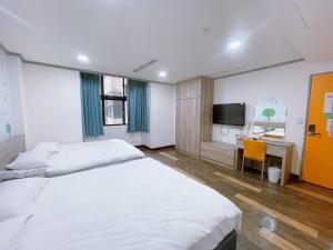 Postelja oz. postelje v sobi nastanitve A22 Wei Lu Hotel