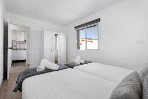 Postel nebo postele na pokoji v ubytování Bonito Apartamento Cristian Playa