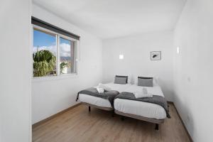 Postel nebo postele na pokoji v ubytování Bonito Apartamento Cristian Playa