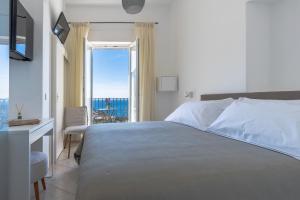 Cama ou camas em um quarto em Albergo La Prora