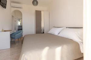 Cama ou camas em um quarto em Albergo La Prora
