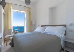 Cama ou camas em um quarto em Albergo La Prora