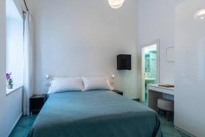 Cama ou camas em um quarto em Albergo La Prora
