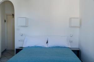 Cama ou camas em um quarto em Albergo La Prora