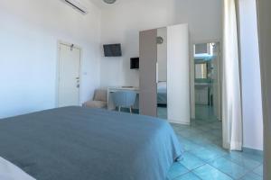 Cama ou camas em um quarto em Albergo La Prora