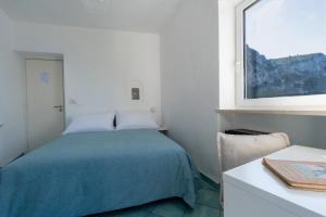 Cama ou camas em um quarto em Albergo La Prora