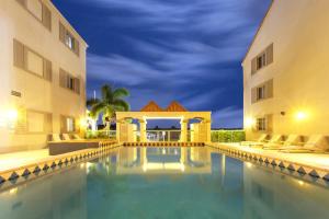 a swimming pool in front of two buildings at Hope Harbour Hotel in Gold Coast